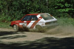 Eric Seppanen / Adam Payeur through a sweeper at the crossroads in their Dodge Omni GLH.