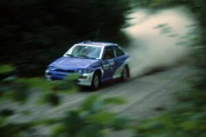 The Carl Merrill / John Bellefleur Ford Escort Cosworth blasts down Parkway Forest Road.