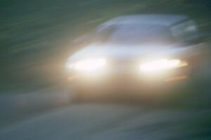 Pete Lahm / Jimmy Brandt at speed in their Datsun 510 down Parkway Forest Road just before sunset.