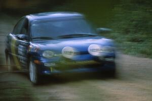 Al Kaumeheiwa / Craig Sobczak at speed down Parkway Forest Road near sunset in their Dodge Neon.