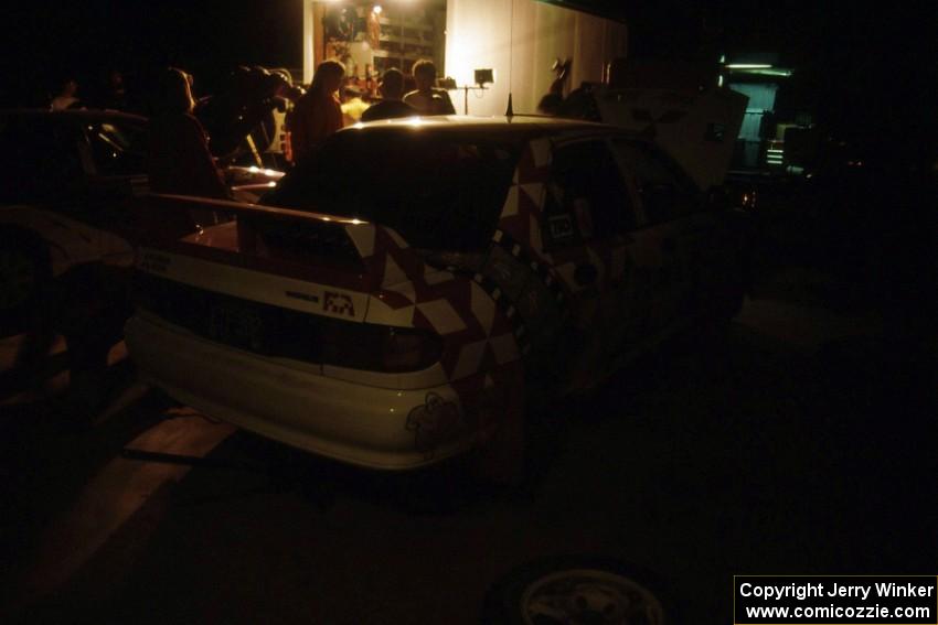 The Henry Joy IV / Mike Fennell Mitsubishi Lancer Evo II gets serviced on the first night of the rally.