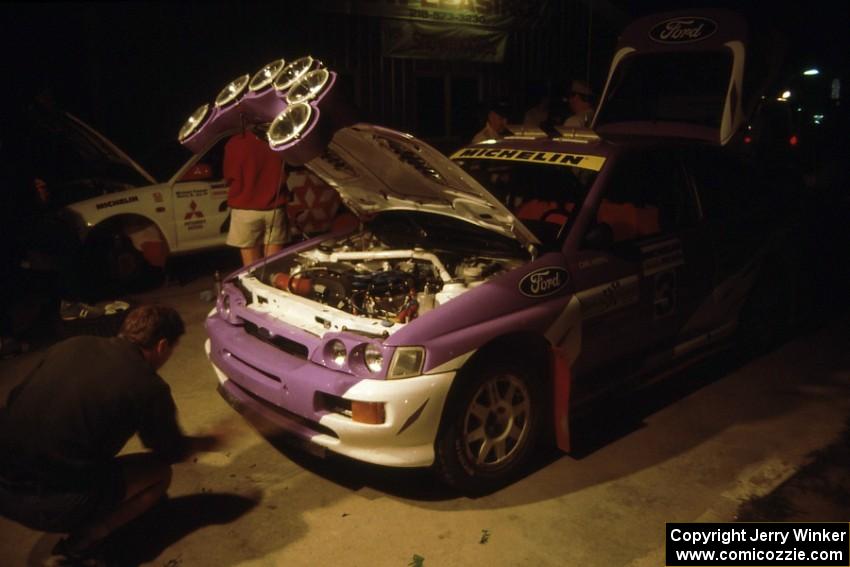 The Carl Merrill / John Bellefleur Ford Escort Cosworth gets serviced on the first night of the rally.