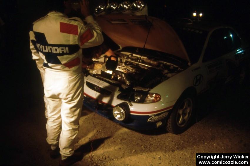 The Paul Choiniere / John Buffum Hyundai Elantra gets serviced on the first night of the rally.