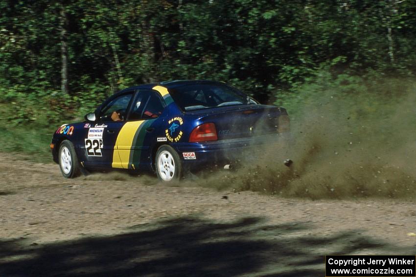 Al Kaumeheiwa / Craig Sobczak drift their Dodge Neon through an uphill sweeper at the crossroads.