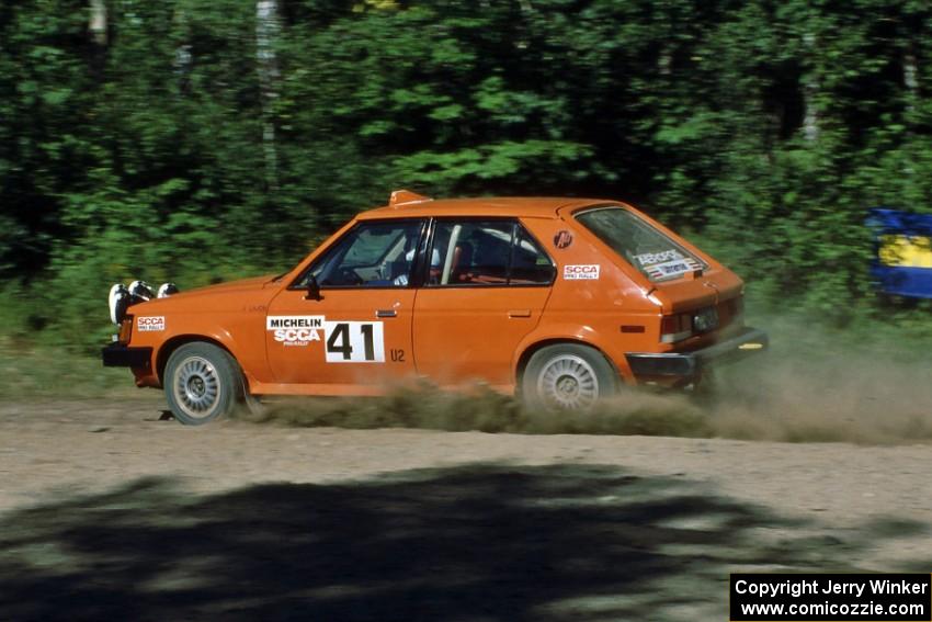 Jason Lajon / John Adleman fly though a sweeper at the crossroads in their Dodge Omni GLH.