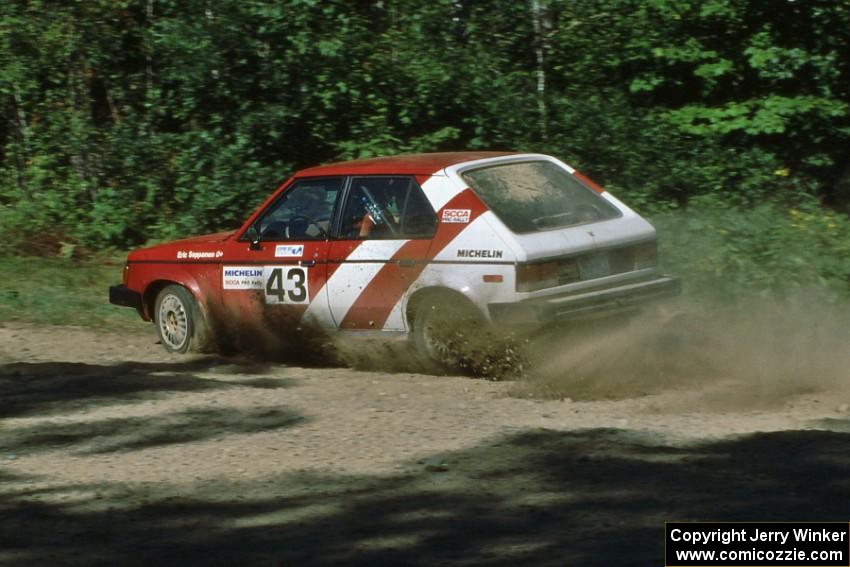 Eric Seppanen / Adam Payeur through a sweeper at the crossroads in their Dodge Omni GLH.