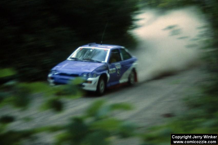 The Carl Merrill / John Bellefleur Ford Escort Cosworth blasts down Parkway Forest Road.