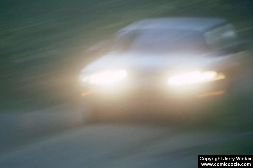 Pete Lahm / Jimmy Brandt at speed in their Datsun 510 down Parkway Forest Road just before sunset.