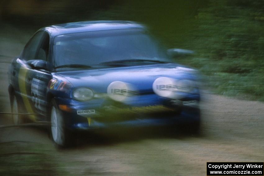 Al Kaumeheiwa / Craig Sobczak at speed down Parkway Forest Road near sunset in their Dodge Neon.