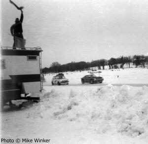 Jerry Hansen's SAAB Sonnet II and Don Roderick's Mini Cooper S lead the field away at the green flag.