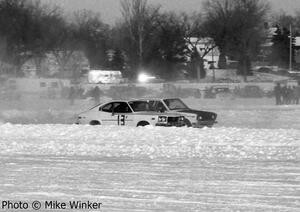 Paul Berg's Mazda RX-3 battles Tim Winker's Datsun 510.