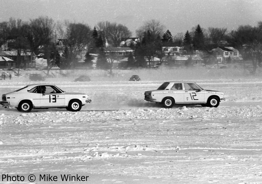 Tim Winker's Datsun 510  battles Paul Berg's Mazda RX-3.