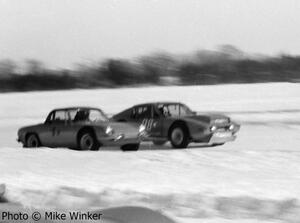 Tom Jones' SAAB Sonett III and and Bill Jenkins's VW-powered Fiat 850 come down the front straight side by side.