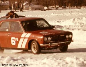 The Mike Winker / Bruce Weinman Datsun 510 lines up onto the grid.