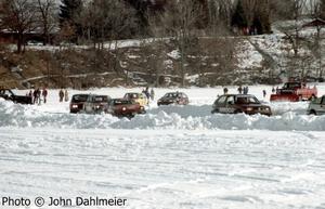 Cars race through the north end of the course