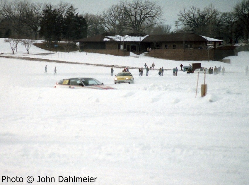 Rick Albrechtson / Scott Kronn Honda CRX heads into turn one ahead of one of the factory Honda team cars.