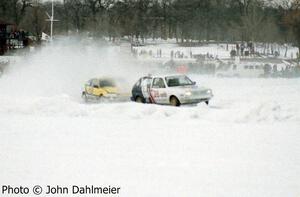 Herm Johnson / Bill Pate works VW GTI leads the Peter Cunningham / John Hogdal works Honda CRX through turn one.