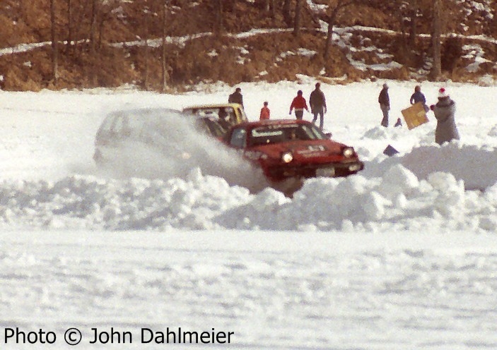 Stu Lenz / Lynn Anderson / Harvey West Triumph TR7 hits a seeper late in the race while followed by three other cars.