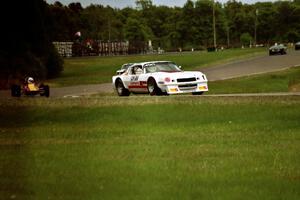 Dave Andryski's Chevy IROC Camaro leads the pack in the Vintage Race