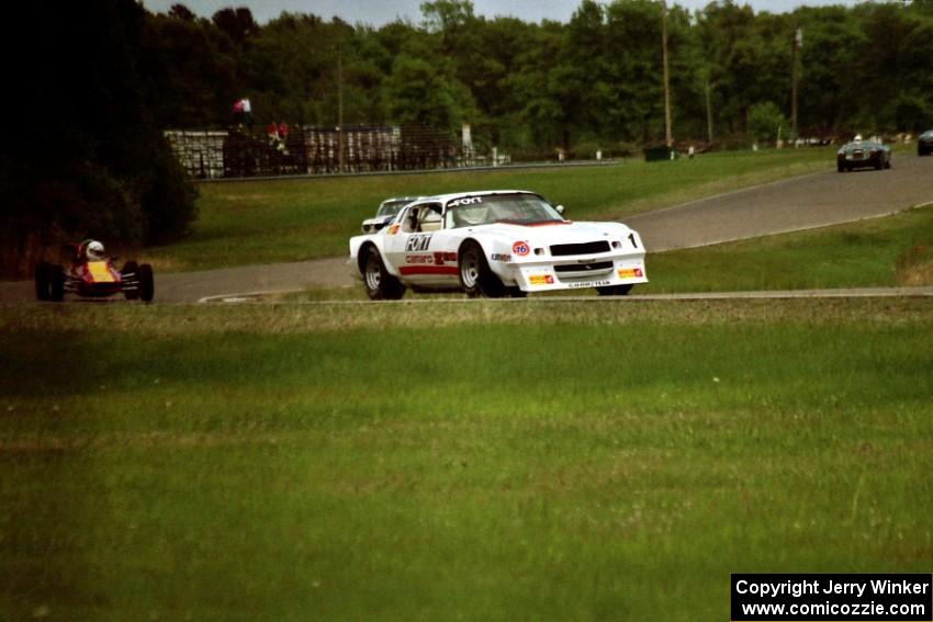 Dave Andryski's Chevy IROC Camaro leads the pack in the Vintage Race