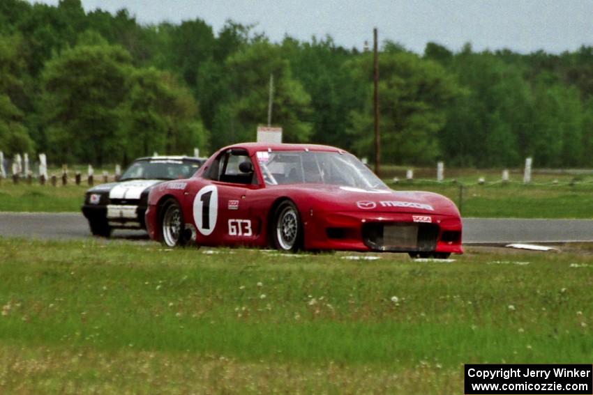 Doug Sherwood's GT-3 Mazda RX-7 and Harvey West's American Sedan Ford Mustang LX