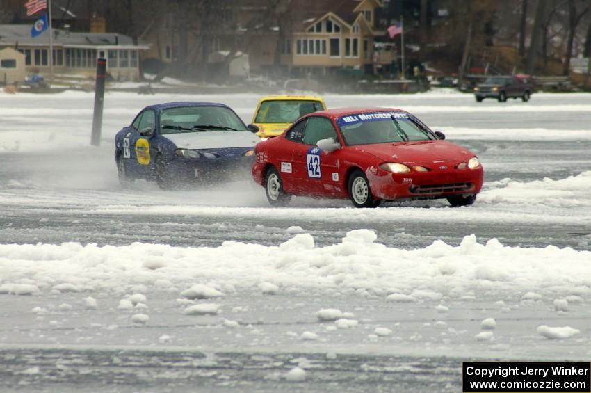 The Ford Escort ZX2s of Ted Mix / Mike Schmidt and Mike Rappa / Don Coatsworth ahead of the Dave Kapaun / Chris Wilke VW Rabbit