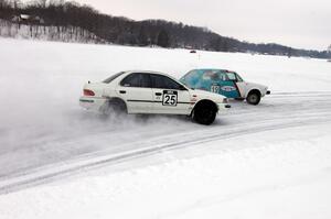 Mike Ehleringer / Dick Nordby / Bill Nelson VW Rabbit and Chris Peterson / Dave McGovern Subaru Impreza battle for the lead