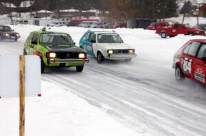 Four cars come into the first corner