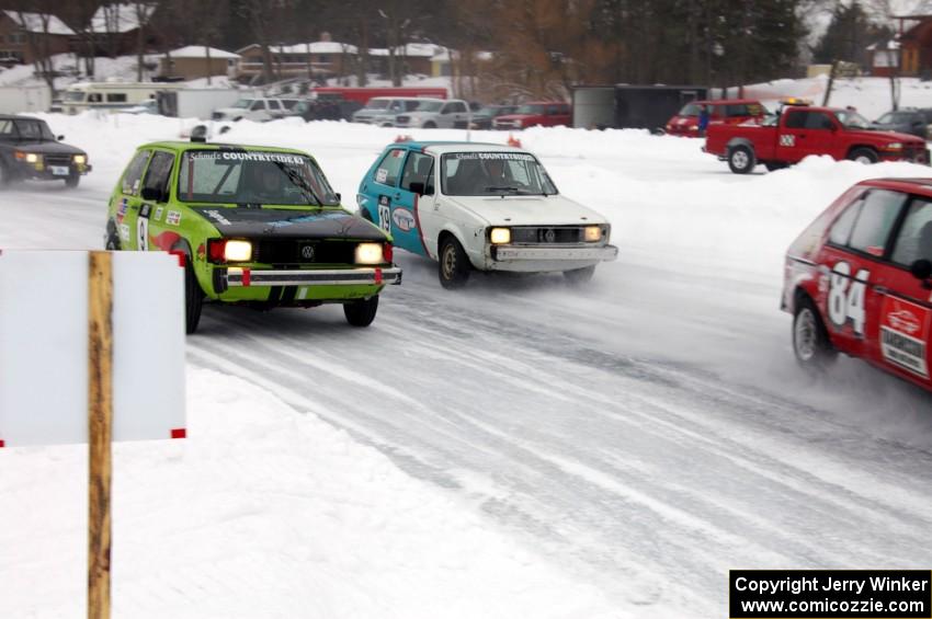 Four cars come into the first corner