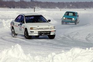 Dave McGovern / Nick Goetz Subaru Impreza is chased by the Dick Nordby / Bill Nelson VW Rabbit