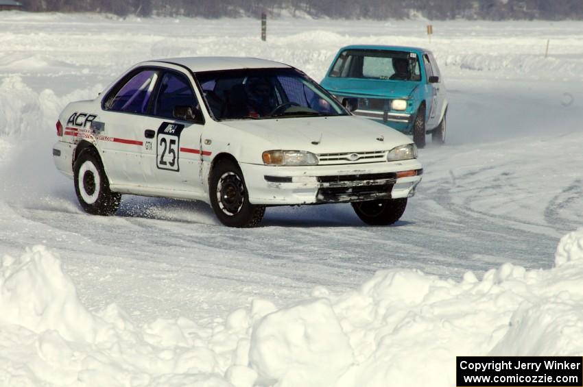 Dave McGovern / Nick Goetz Subaru Impreza is chased by the Dick Nordby / Bill Nelson VW Rabbit