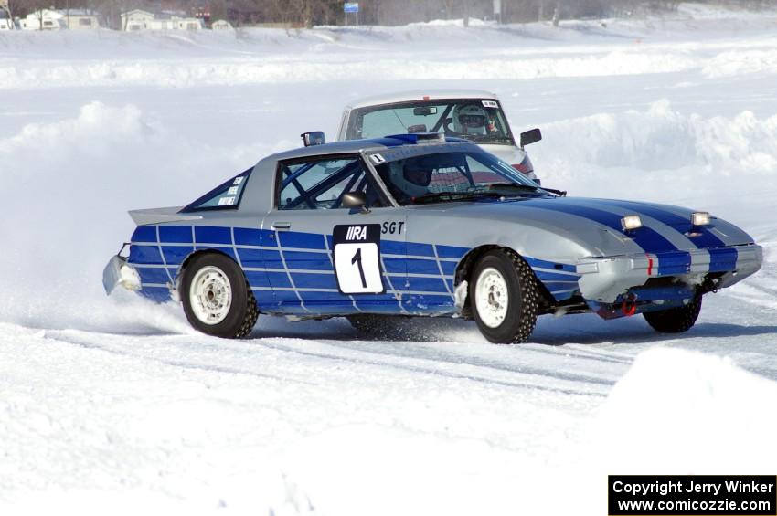 Steve Kuehl / Marco Martinez Mazda RX-7 is followed by the Chuck Peterson / Bob Roth SAAB 99