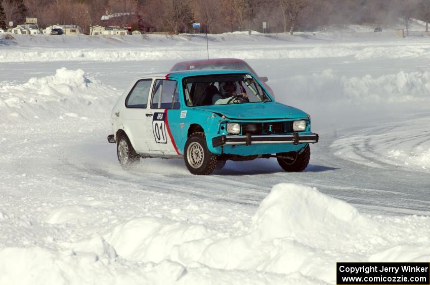 Dick Nordby / Bill Nelson VW Rabbit passes the Jason Beck / Kevin Beck Dodge Shadow