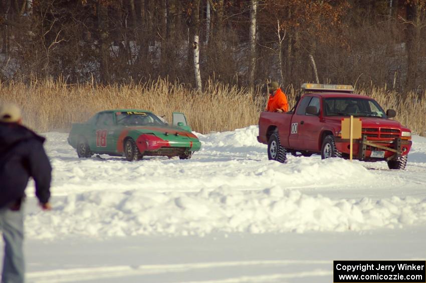 Don Hupe / Marco Martinez / Steve Kuehl Mazda RX-7 gets a tow, however an engine fire breaks out