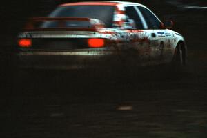 The Henry Joy IV / Michael Fennell Mitsubishi Lancer Evo 2 sprays gravel on the press stage.