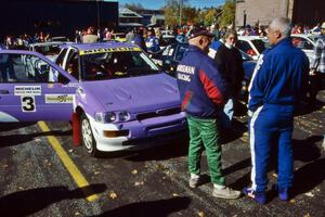 John Bellefleur and Selcuk Karamanoglu have a chat in front of the Carl Merrill Ford Escort Cosworth RS at parc expose.