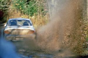 Paul Choinere / John Buffum in the Hyundai Elantra hit a huge puddle at speed before the final bridge on the Menge Creek stage.