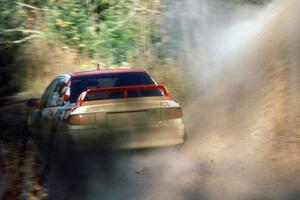 The Henry Joy IV / Michael Fennell Mitsubishi Lancer Evo 2 hit a puddle near the final Menge Creek 1 bridge.