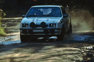 The Henry Krolikowski / Cindy Krolikowski Dodge Shadow at speed on Menge Creek 1.