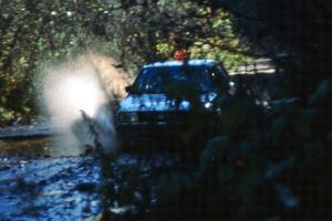 Art Burmeister/ Eric Burmeister hit a puddle in their VW GTI before the final Menge Creek bridge.