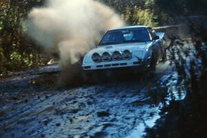 Ted Grzelak / Dan Gildersleeve hit a puddle at speed in their Mazda RX-7 only to have ...