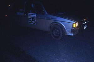 The VW Rabbit of Heikke Nielsen / Bob Nielsen pull into the start of a night stage.