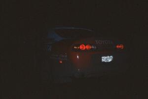 The Ralph Kosmides / Joe Noyes Toyota Supra awaits the start of the stage in almost complete darkness.