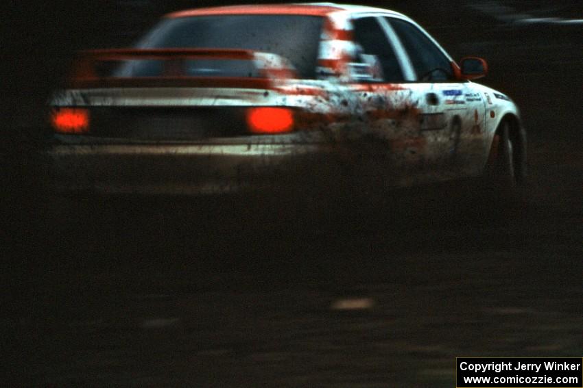 The Henry Joy IV / Michael Fennell Mitsubishi Lancer Evo 2 sprays gravel on the press stage.