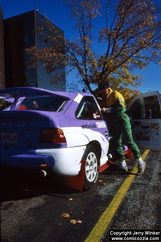 John Bellefleur climbs from the Carl Merrill Ford Escort Cosworth RS before the start of parc expose.