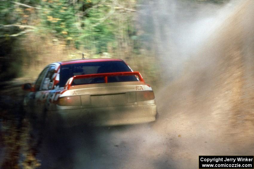 The Henry Joy IV / Michael Fennell Mitsubishi Lancer Evo 2 hit a puddle near the final Menge Creek 1 bridge.