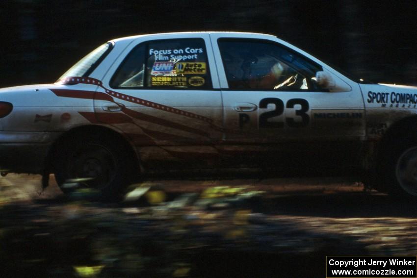 Lon Peterson / Bill Gutzmann in the factory-backed Production class Kia Sephia seen here on Menge Creek 1.