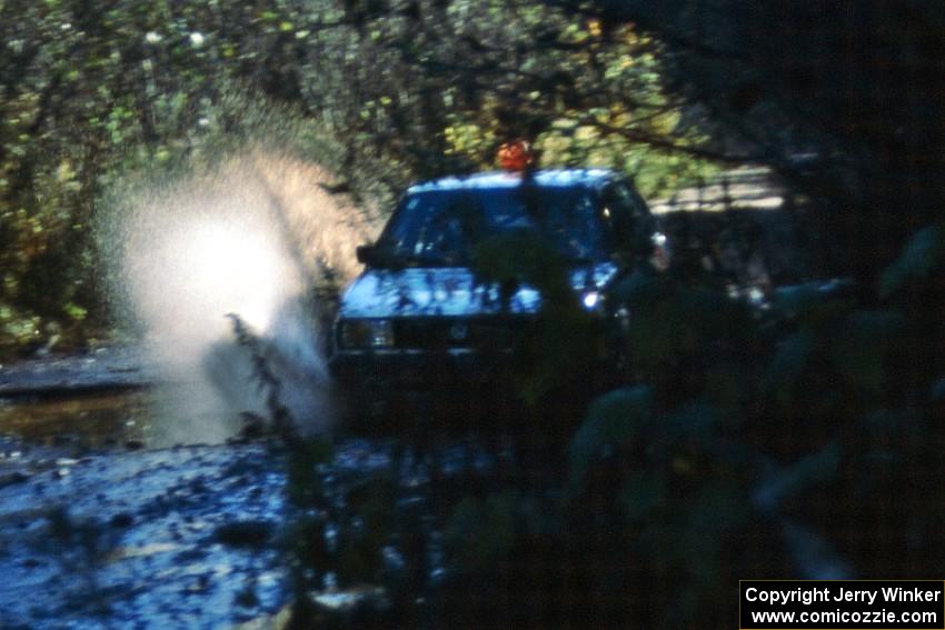 Art Burmeister/ Eric Burmeister hit a puddle in their VW GTI before the final Menge Creek bridge.