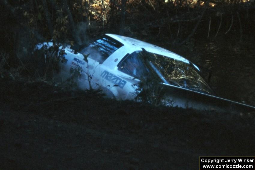 Ted Grzelak / Dan Gildersleeve Mazda RX-7 flew over and cleared Menge Creek, but there was no way of getting back on the road.