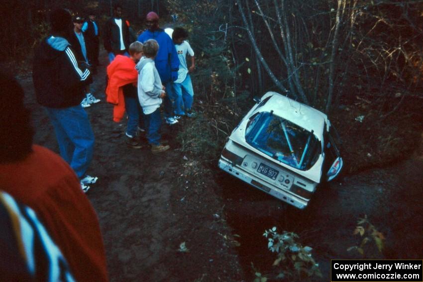 Spectators flocked to the scene of the wrecked Ted Grzelak / Dan Gildersleeve Mazda RX-7 on the bank of Menge Creek.